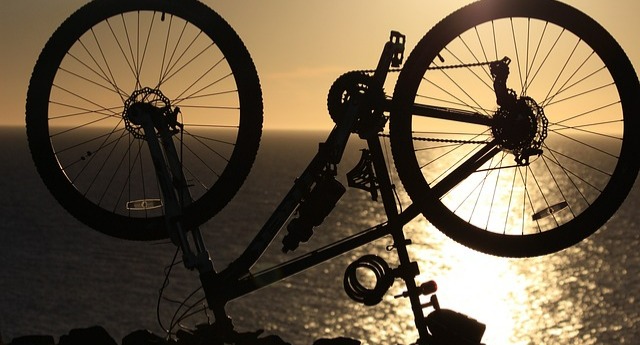 Mountain bike upside down overlooking the ocean
