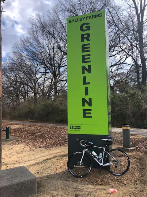 Richard's bike in front of Greenline sign