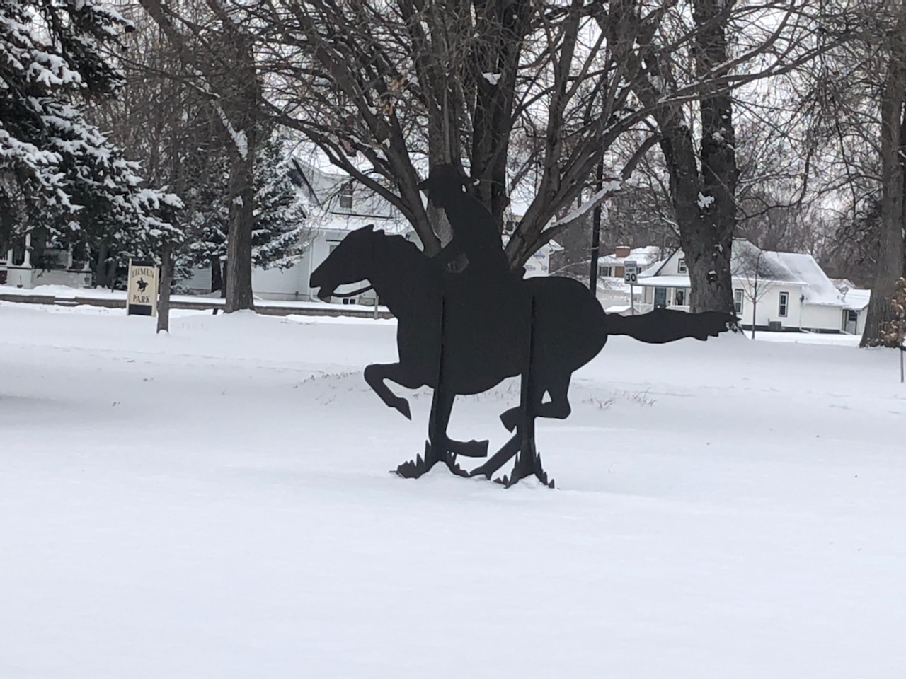 Metal cutout of a pony with a rider for the express
