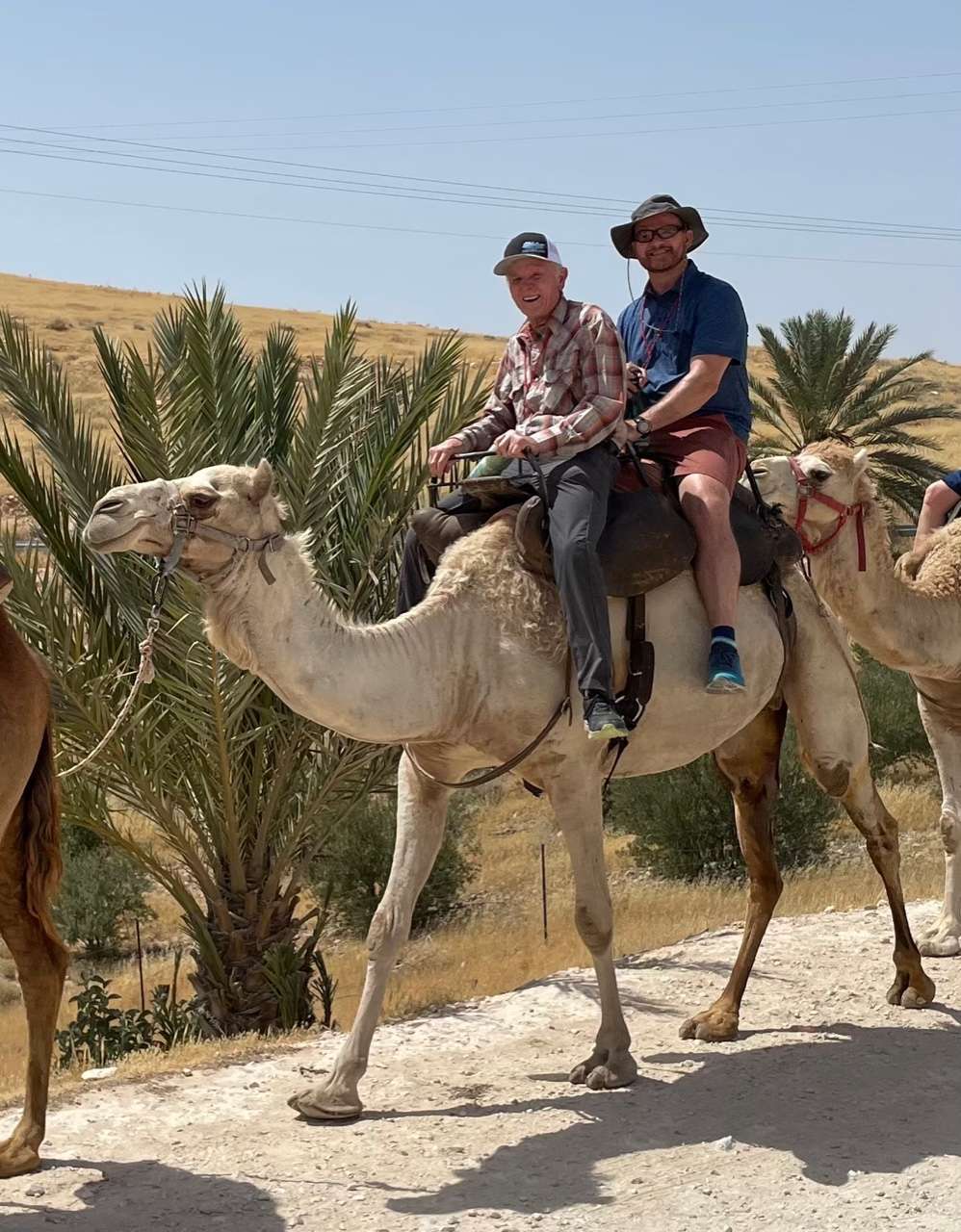 Another angle of Jake and Richard on a Camel