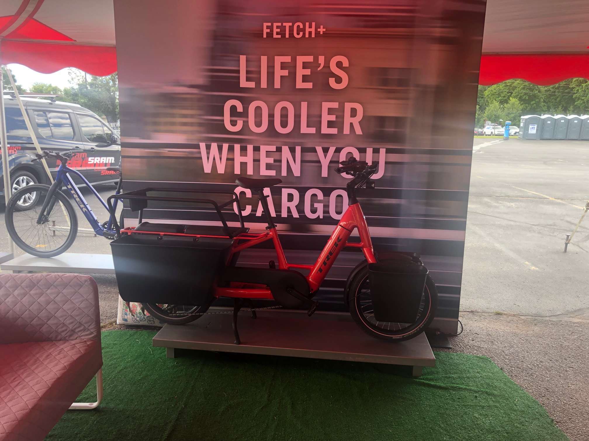 Cargo Ebike; tricycle with a battery, and big bags on the back