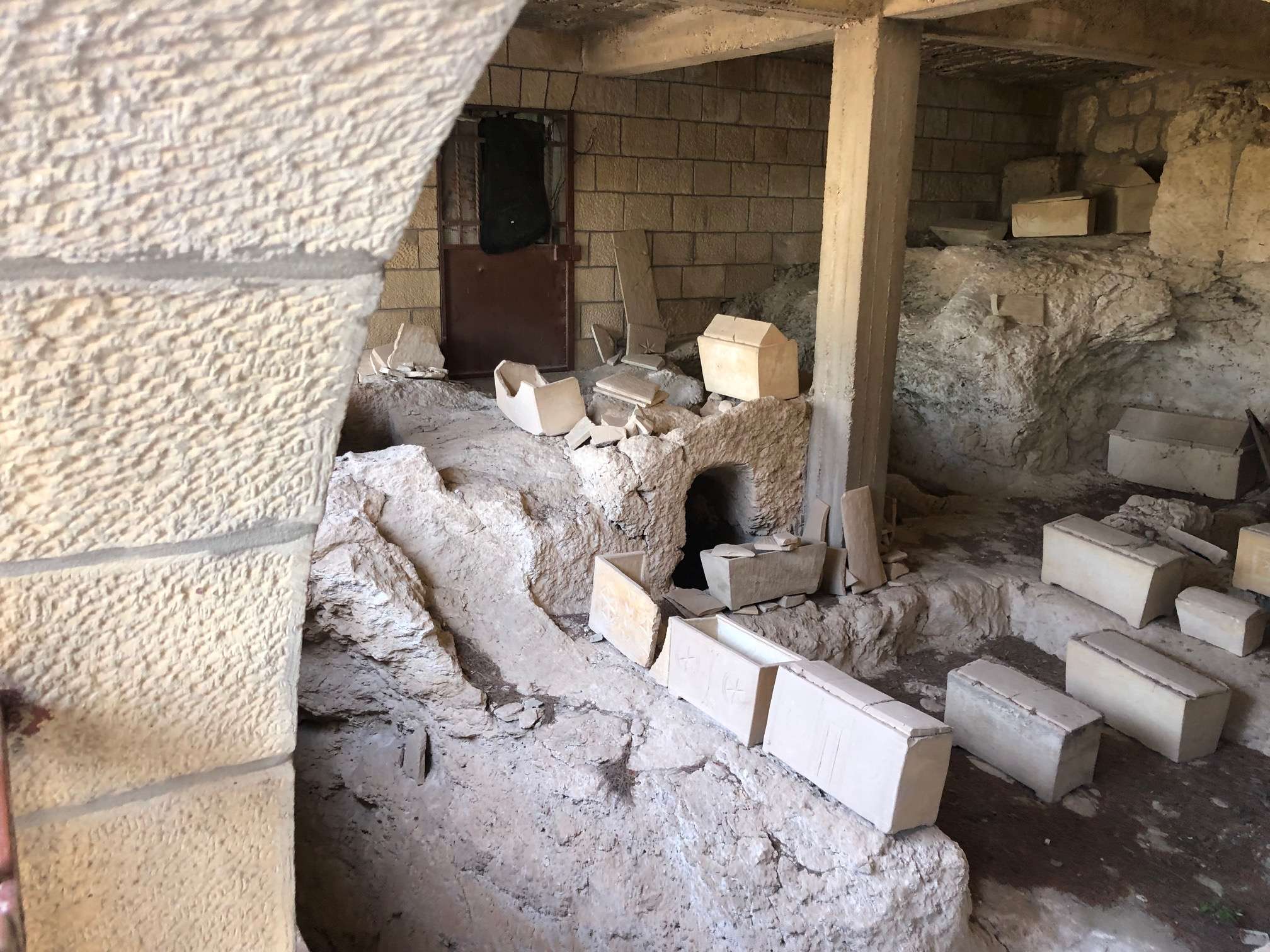 Tomb full of boxes with bones