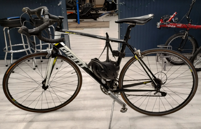 Black frame with white and yellow accents. Black helmet attached