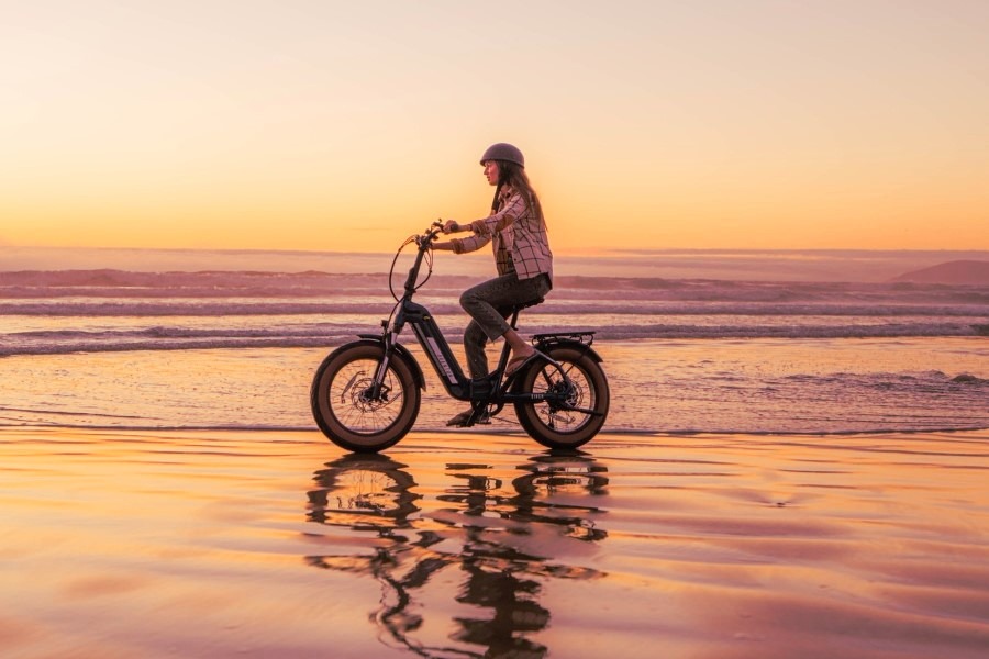 beach cyclist with sunset