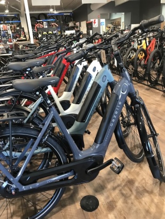 row of Gazelle electric bikes at the store