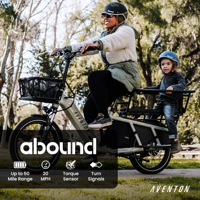 woman and child riding on cargo e-bike
