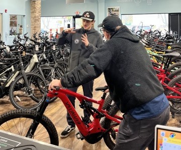 two men in a bike store