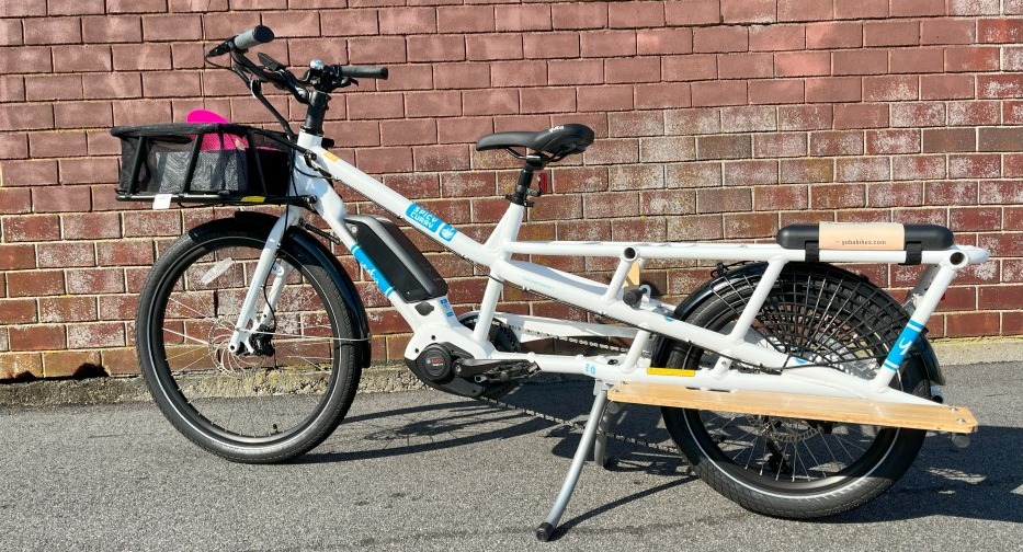 cargo ebike in front of a brick wall