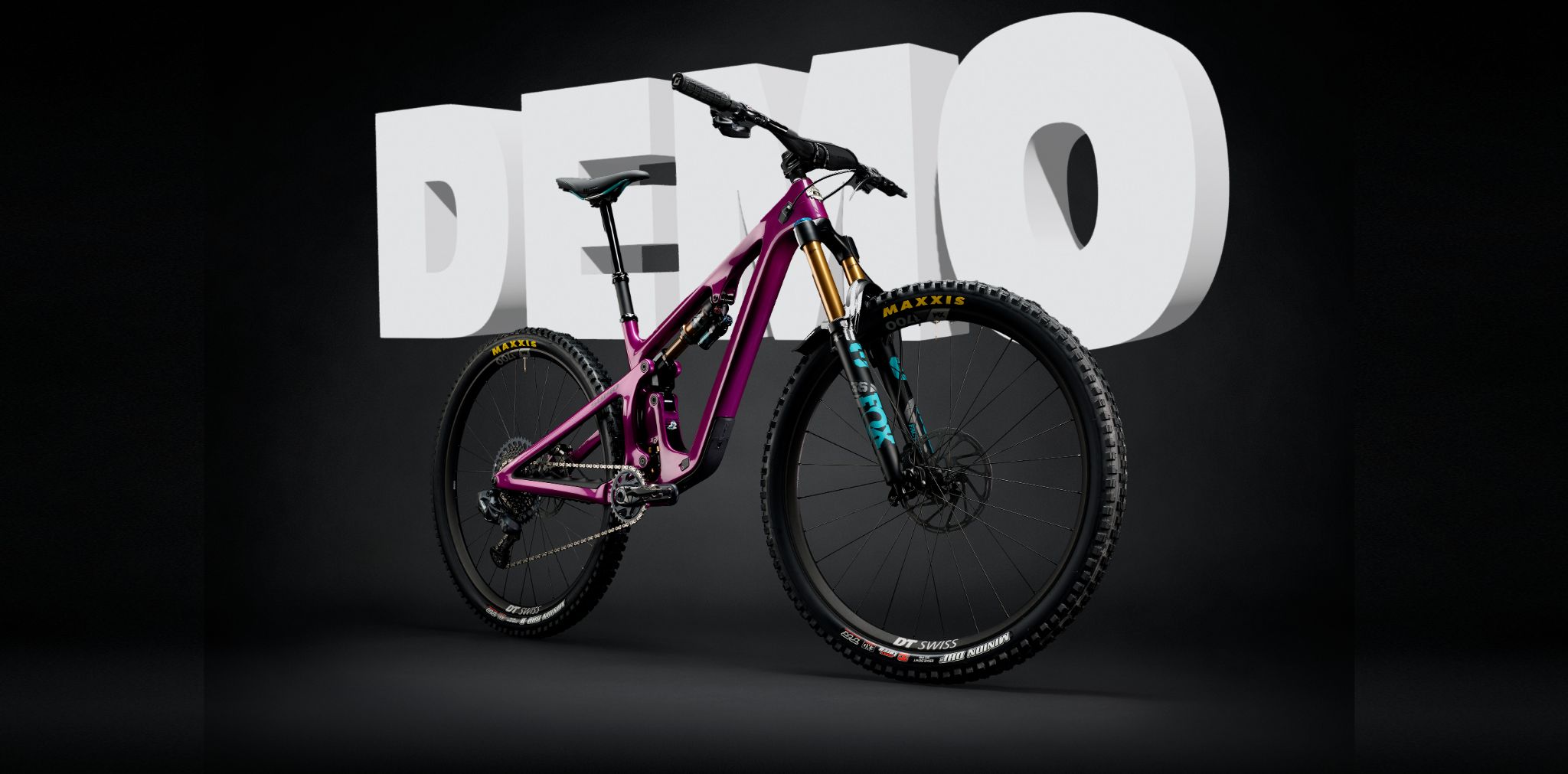 Yeti Full suspension mountain bike in front of large block text that reads "DEMO"