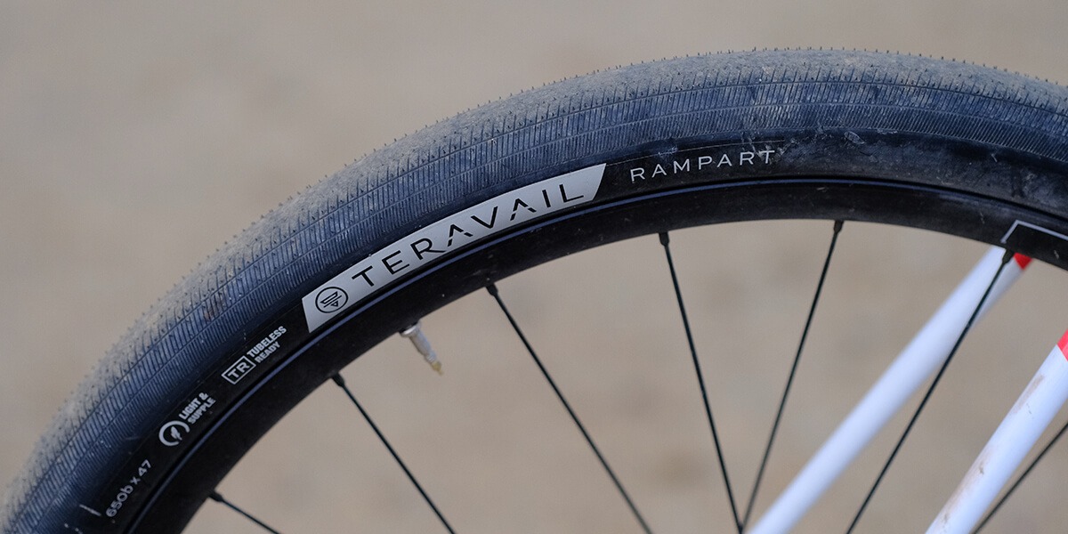 Closeup image of a Teravail Rampart tire mounted on to the rear wheel of a bike.