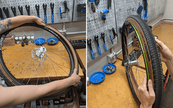A Teravail tubeless tire is being fit onto a bike rim at a workbench.