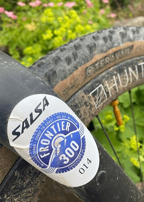 A sticker for the Salsa Frontier 300 is stuck to the fork on a bike