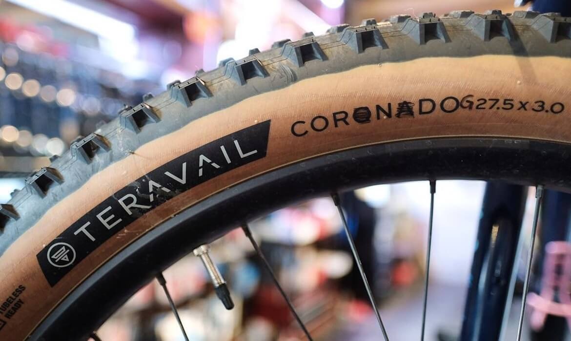 A closeup of a tire sidewall, where the name "Coronado" has been changed to "Corndog" with a marker