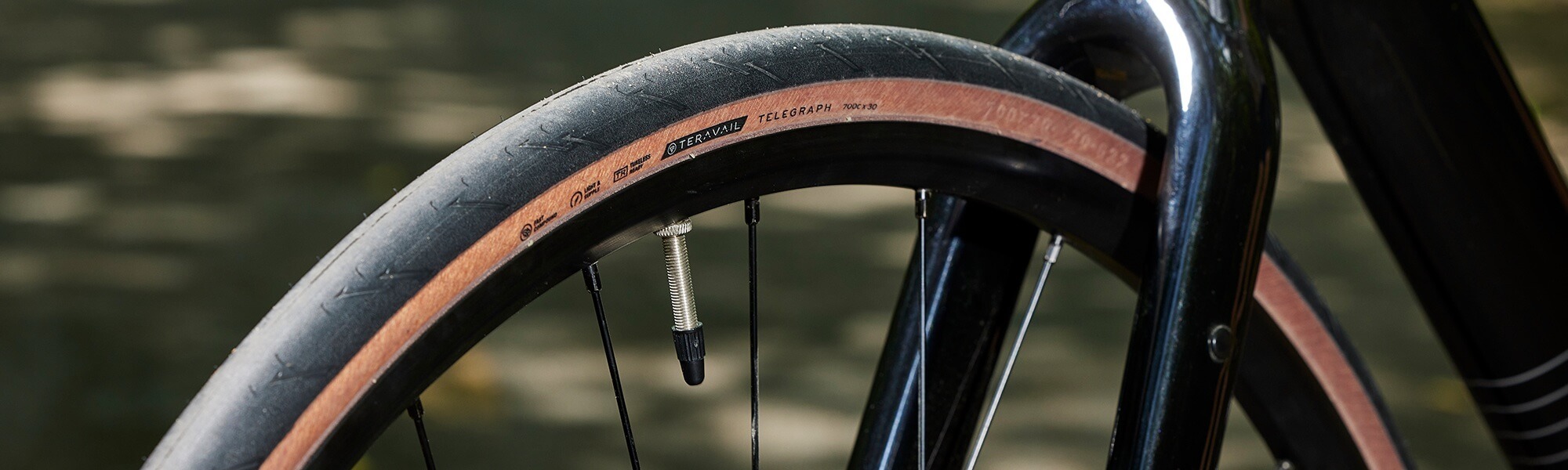 Closeup view of the front end of a bike with a Teravail Telegraph tire mounted.
