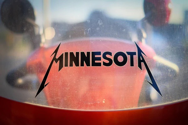 "Minnesota" is written on glass in wild font