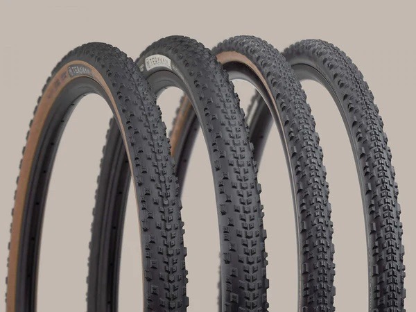 Teravail Rutland tires with treads visible lined up against a brown background