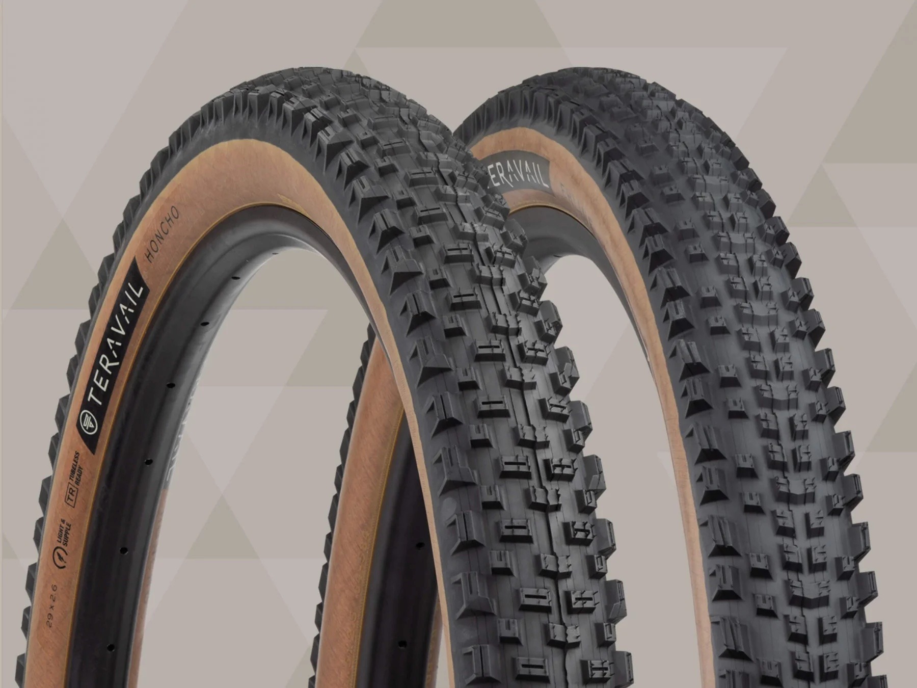 Teravail Honcho and Ehline tires on a tan background with tread detail visible