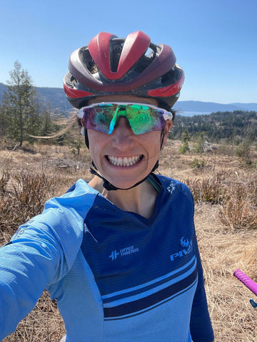 Courtney McFadden taking a smiling selfie in her helmet and sunglasses