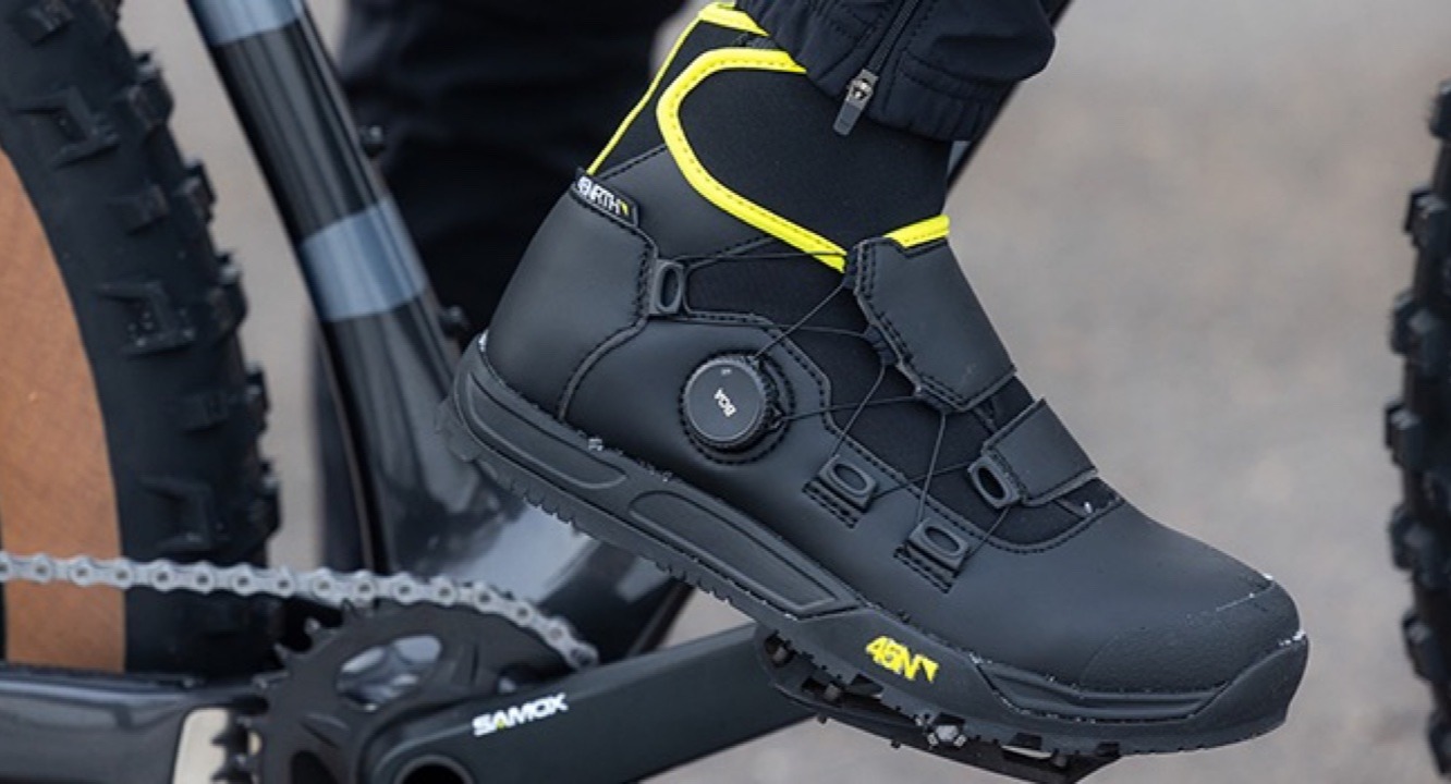 Closeup of a cyclist's ragnarok boot on a bike pedal