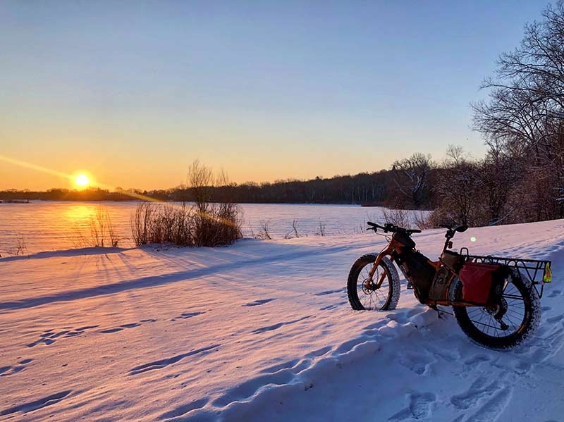 bike with snow with sunrise