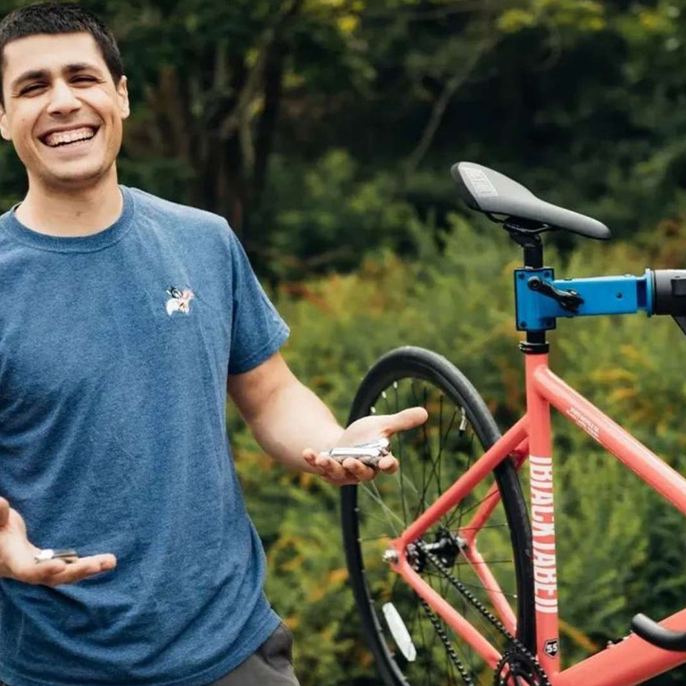 smiling person with bicycle