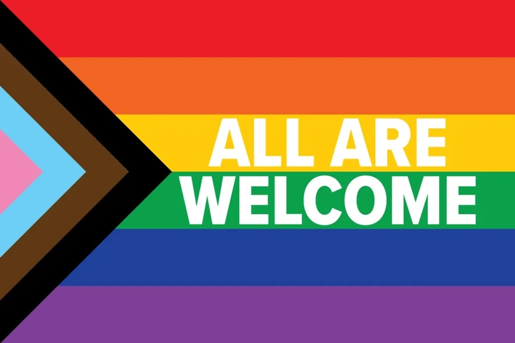 Progress Pride Flag with text on top that reads "All Are Welcome"