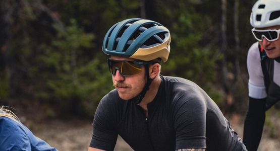 Road cyclist wearing helmet and sunglasses