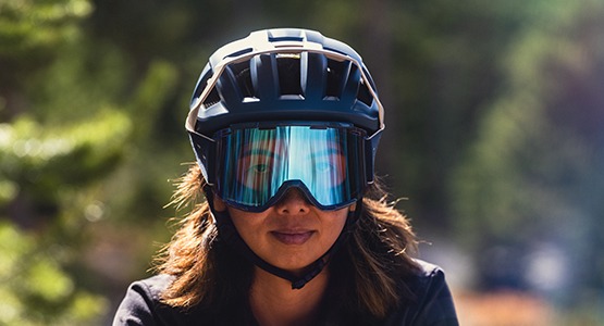 trail riding goggles and half shell helmet