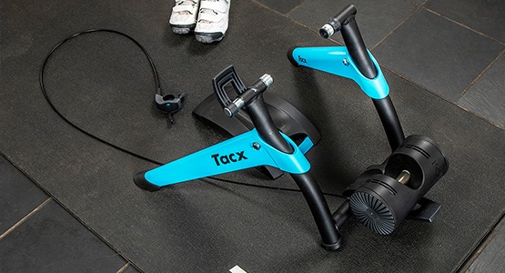 bike trainer sitting on foam mat with cycling shoes