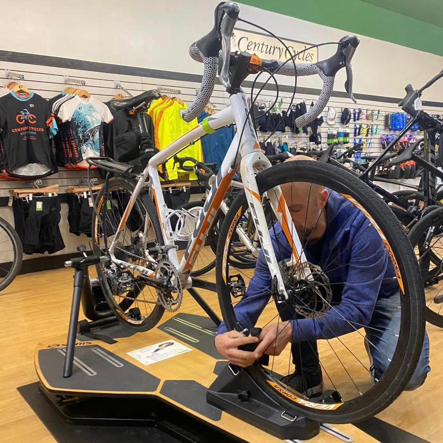 Matthew Shieferstein sets up a road bicycle for a bike fitting customer in Shaker Heights.